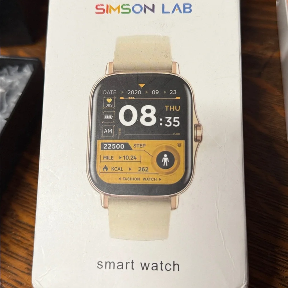 Silver Simpson lab smart watch. Comes with charger and band